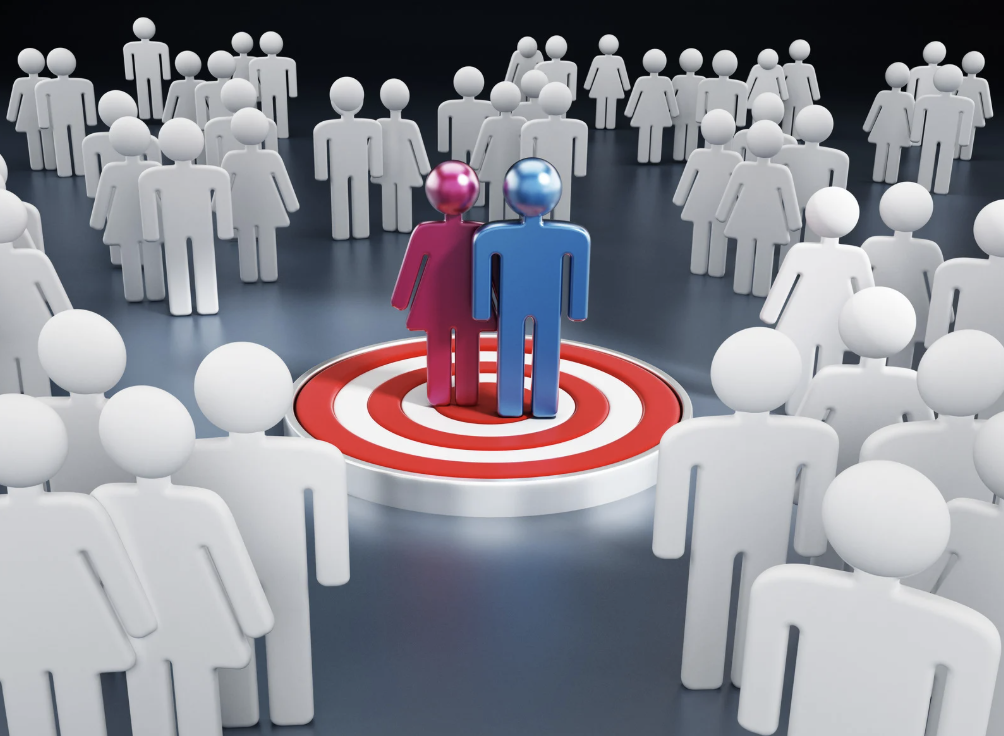 Image with groups of people and a target symbol to indicate the intended audience.
